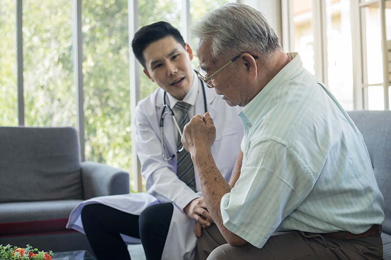 An elderly man contemplating colon cancer surgery